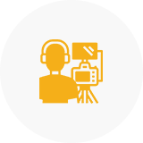 Person with camera and headphones icon.